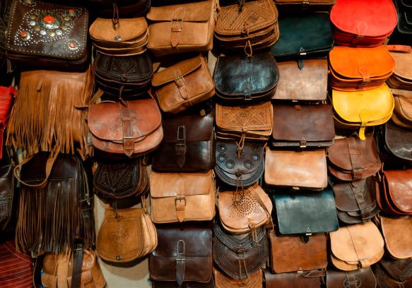 Arab handbags and wallets shop with colorful items.
