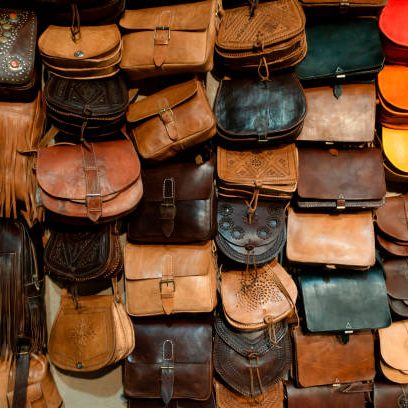 Arab handbags and wallets shop with colorful items.