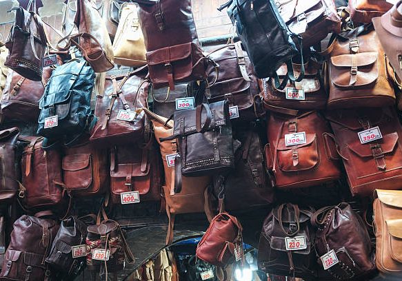 27 DEC 2024 Marrakesh, Morocco - Leather goods and Bags  on display in a Moroccan market stall in the Medina